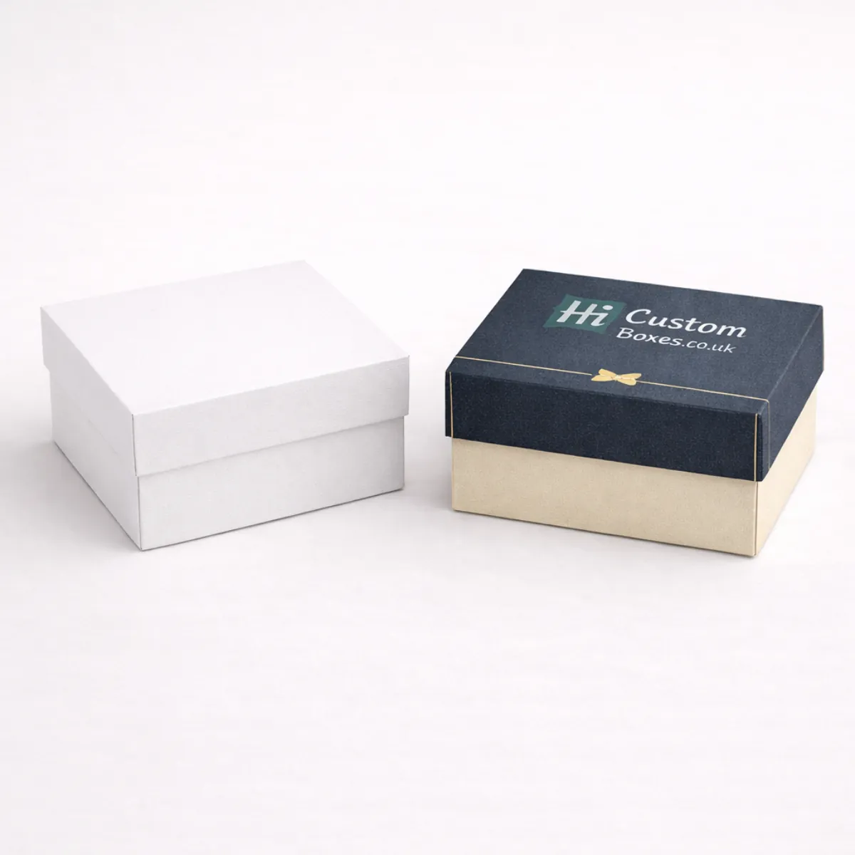 Two premium two-piece square gift boxes with lids- shown in white and branded navy blue-